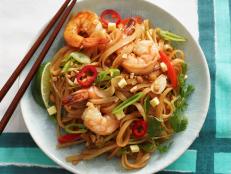 We absolutely love Thai food but it wasn't a cuisine that I cooked much at home until I got Jet Tila's cookbook "101 Thai Dishes You Need to Cook Before You Die." He does a great job of explaining ingredients and has a shopping list of what you need to stock your pantry. While this recipe is not exactly like an authentic pad Thai, I use an ingredient that has become a staple at our house since I started cooking Jet's recipes: tamarind paste. It really flavors the dish and I've found myself adding it to recipes like BBQ sauce, and I even put it in my corn chowder. This noodle dish is light, fresh and heavy on the veggies for summertime.