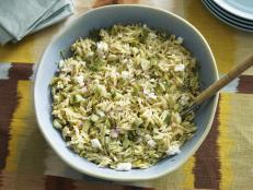 Pouring the dressing over the pasta while it is still warm is essential to making sure it absorbs all the flavors. This orzo salad has crunch, sweetness and brightness and is the perfect side dish for a summer lunch.