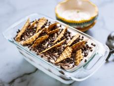 This is a no-churn ice cream, which removes a lot of the hard work from the usual process. You can switch in any flavor combos you like, but here Ree has mixed chocolate, orange and vanilla, and added a delicious crunch using broken waffle shells.