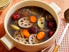 This vegan soup offers a beautiful balance of flavors with earthy lotus root, sweet carrots and jujubes dates, warming ginger and savory mushrooms and peanuts. Soups like this one are a staple on many Chinese family&rsquo;s dinner tables not only because they&rsquo;re light and delicious but also because their ingredients are believed to have healing properties. According to traditional Chinese medicine, a soup&rsquo;s botanical ingredients, broadly known as &ldquo;herbs,&rdquo; are thought to help with everything from calming inflammation to improving vision to boosting energy. Regardless of health claims, it&rsquo;s certain that each plays a role in making this soup comforting and refreshing, with eye-catching wedges of lotus root as the star. Although most recipes for lotus soup contain pork ribs we made this one vegan, using shiitake mushrooms to give the broth depth of flavor instead. Many of the ingredients require soaking, so be sure to start the process either the night before or in the morning so that you can have this nourishing hot soup ready by dinner.