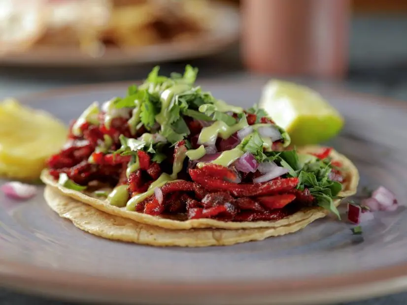 Taco Al Pastor prepped by Chef Jorge Rojo at Ro-Ho Pork & Bread in San Antonio, Texas, as seen on Food Network's Diners Drive-Ins and Dives, season 39.