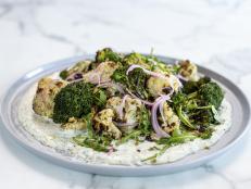 Ree likes to char her broccoli and cauliflower outside on the grill for extra color and flavor. This is a great side dish to serve at any barbecue with grilled seafood and meat, or to take to a potluck.