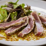 Close-up, Rare Seared Tuna with Greens and Soy-Ginger Vinaigrette