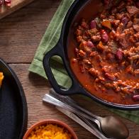 Classic Southwestern Chili in a Cast Iron Dutch Oven with Corn Bread and Cheddar Cheese