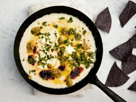 Goat Cheese Queso Fundido with Roasted Green Chile Sauce and Blue Corn Tortilla Chips