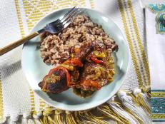 My stewed chicken is inspired by Bryon and my trip to Belize. Fall-off-the-bone tender chicken is marinated and stewed with peppers and spices. Serve alongside my coconut rice and beans and you can bring the flavors and smells of Belize into your own kitchen.
