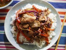 This Chinese-inspired stir-fry is one of our quick weeknight family favorites. Ryan loves pork, and thinly slicing the tenderloin makes it cook in a snap. The homemade chile oil gives some nice heat, and of course, it can be left off for the little ones.