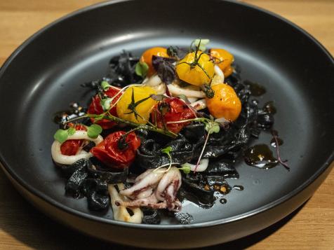 Squid Ink Fettuccine with Caramelized Rainbow Cherry Tomatoes and Calamari
