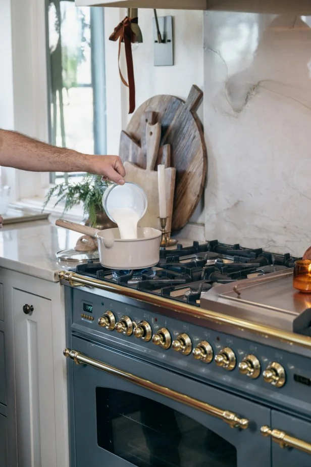 Hosts Dave and Jenny Marrs making cookies in their kitchen, as seen on Fixer to Fabulous Holiday Social Project on HGTV.