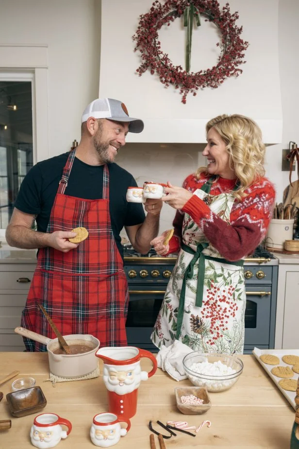Hosts Dave and Jenny Marrs pose in their kitchen, as seen on Fixer to Fabulous Holiday Social Project on HGTV.
