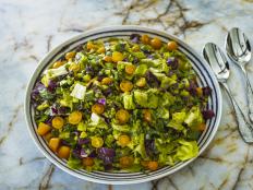 This salad is similar to a roughly chopped coleslaw, and there is a lot of flavor emanating from the jalape&ntilde;os, Parmesan, basil and lemon. Ree served this in the middle of summer, when she had a glut of cherry tomatoes, so her recipe has little pops of red over the top!