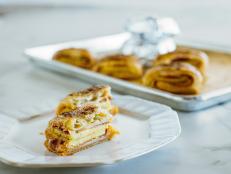 Ree&rsquo;s breakfast croissants involve a filling made of eggs, cured meat and cheese, all wrapped in puff pastry. They are ideal for a grab-and-go meal on busy mornings.