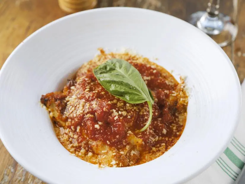Lasagna as prepared by Owner Andrea Neri at Molto Trattoria in Naples, Florida as seen in Food Network's Diners Drive-Ins and Dives, season 40.