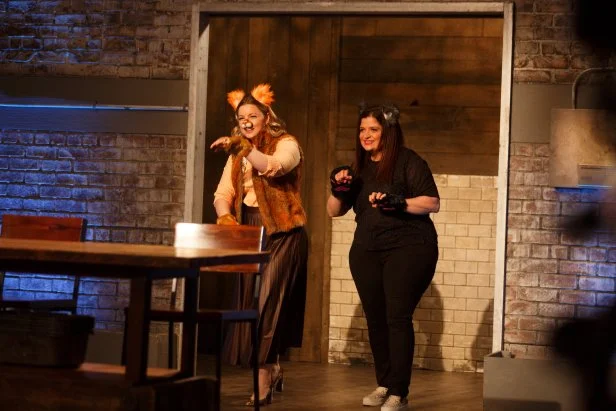 Co-hosts Damaris Phillips and Alex Guarnaschelli enter Kitchen Stadium dressed as cats, as seen on Beat Bobby Flay, Season 24.