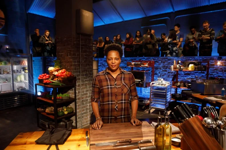 Contender Dawn Burrell poses at her station before Round 1, as seen on Beat Bobby Flay, Season 28.