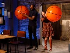 Co-hosts Amar'e Stoudemire and Katie Lee enter Kitchen Stadium, as seen on Beat Bobby Flay, Season 30.