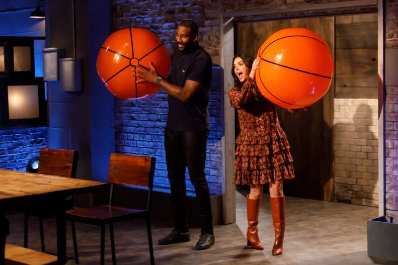 Co-hosts Amar'e Stoudemire and Katie Lee enter Kitchen Stadium, as seen on Beat Bobby Flay, Season 30.
