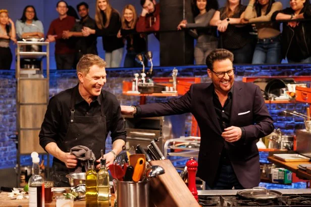 Co-host Scott Conant laughs with chef Bobby Flay as he checks out his Round 2 dish, as seen on Beat Bobby Flay, Season 33.