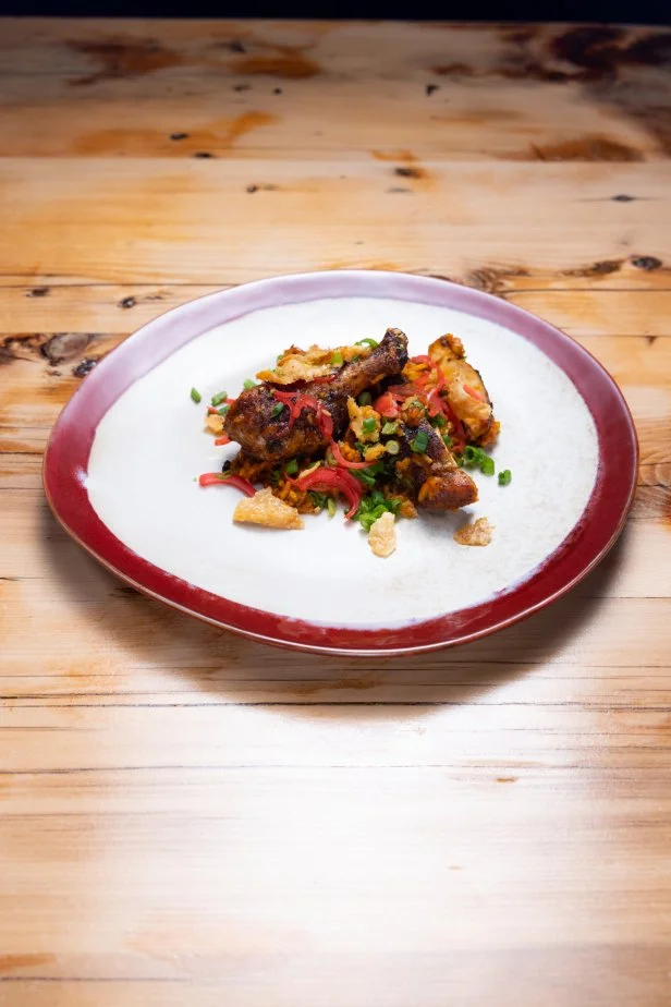 Host Bobby Flays signature dish, Chicken Jollof Rice, as seen on Beat Bobby Flay, Season 40