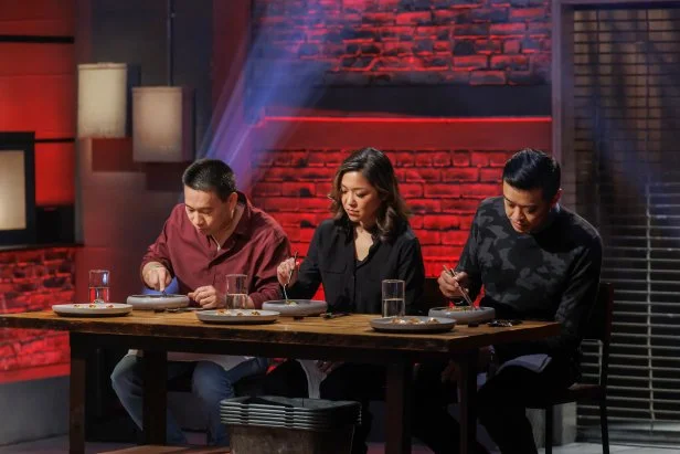 Judges Chris Cheung, Emmeline Zhao, and Wilson Tang taste test the final dish in Round 2.