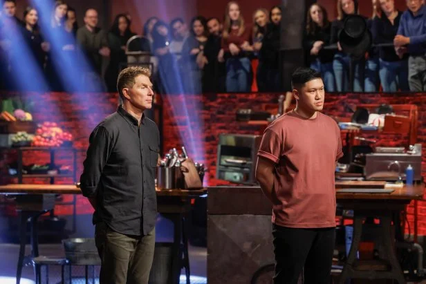 Bobby Flay and Laurence Louie nervously stand side by side as the judges make their decision.