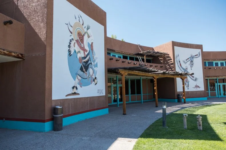 Building Exterior With Two Large Murals