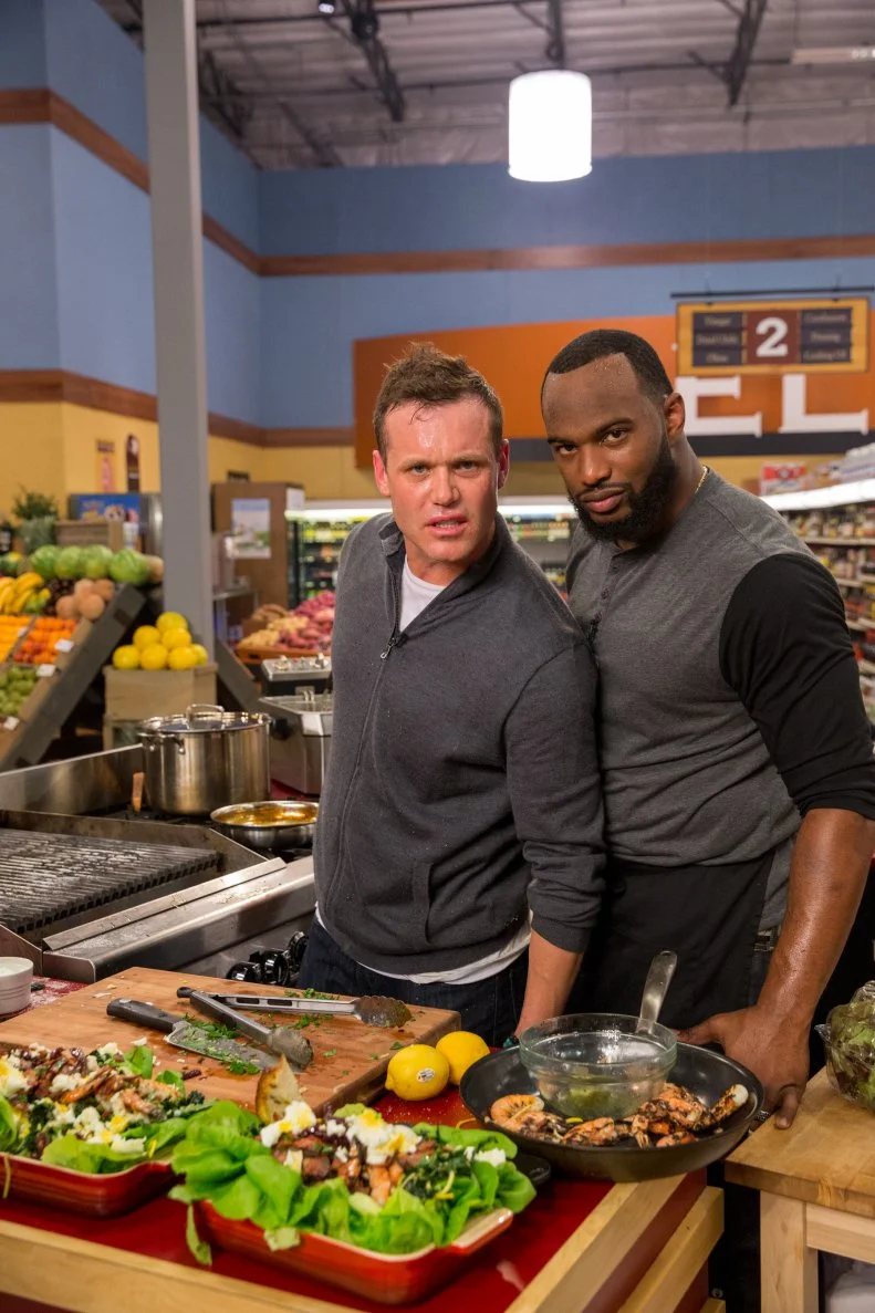 Celebrity Chef Brian Malarkey and Pro Athlete Marcel Reece with their finished dish during Game 2, Let It Roll, as seen on Food Network's Guy's Grocery Games, Season 7.