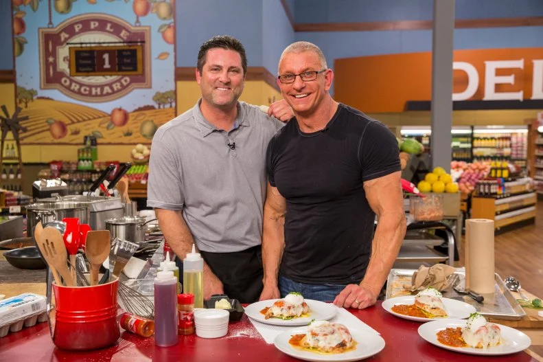 Pro Athlete Rich Aurilia and Celebrity Chef Robert Irvine with their finished dish during Game 2, Let It Roll, as seen on Food Network's Guy's Grocery Games, Season 7.