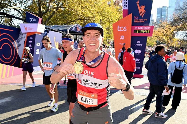 NEW YORK, NEW YORK - NOVEMBER 02: Oliver Phelps poses at the finish line during the 2025 New York City Marathon on November 02, 2025 in New York City. (Photo by Bryan Bedder/New York Road Runners via Getty Images)