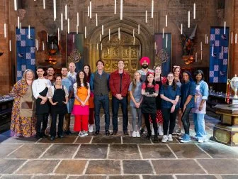 Hosts James Phelps and Oliver Phelps pose with contestants Jenny Chambers, Rui Mota, Alex Madrigal, Angel Figueroa, Andy Ortega, Stefan Rose,Kate Sigel, Heather Tocco, Katie Bonzer, Jujhar Mann, Marjorie Santaromana, Sarah Arnold, Caitlin Taylor, Molly Robbins, Jaleesa Mason, and Priya Winsor, as seen on Harry Potter: Wizards of Baking, Season 2.