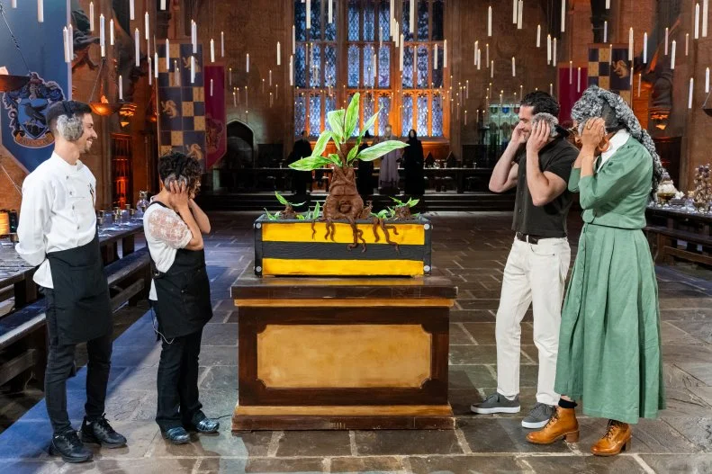 Judge Carla Hall and Judge Jozef Youssef during judging of contestants Angel Figueroa and Rui Mota’s showpiece titled ‘ROOTing out the Hufflepuffs’, as seen on Harry Potter: Wizards of Baking, Season 2.