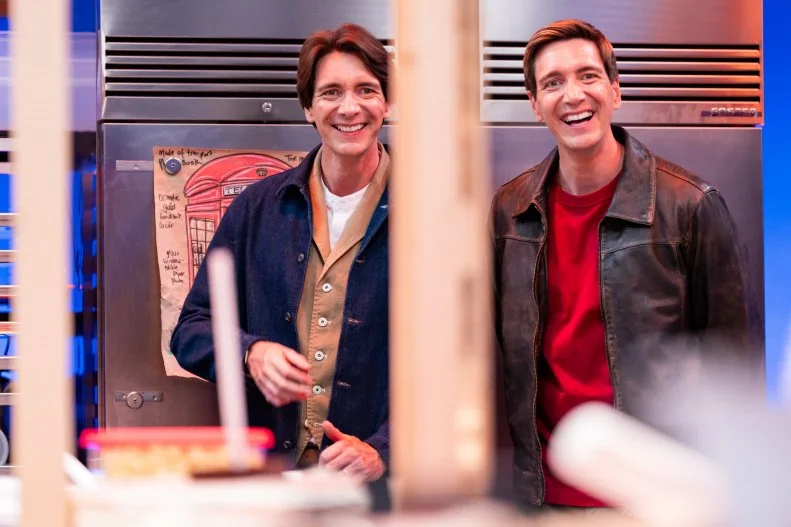 Hosts James and Oliver Phelps, as seen on Harry Potter: Wizards of Baking, Season 2.