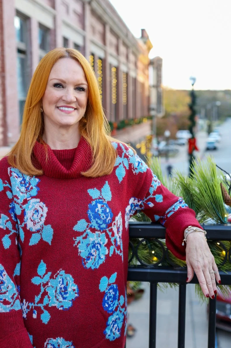 Ree Drummond standing near The Mercantile, as seen on The Pioneer Woman: Hometown Stories, season 1.