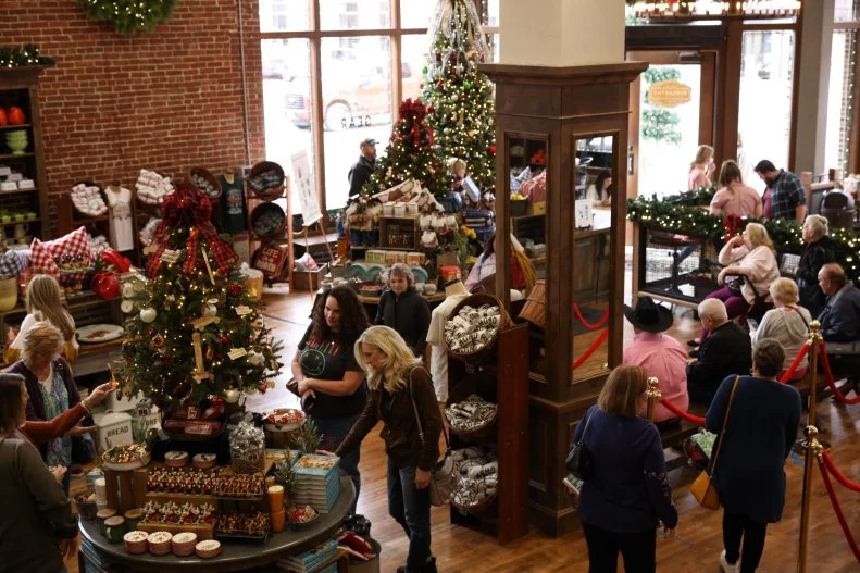 A view of customers and Christmas decorations at The Mercantile, as seen on The Pioneer Woman, season 1.
