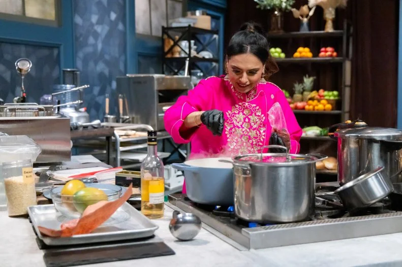 Chef Maneet Chauhan prepares round 1 dish, as seen on Bobby’s Triple Threat, Season 4.