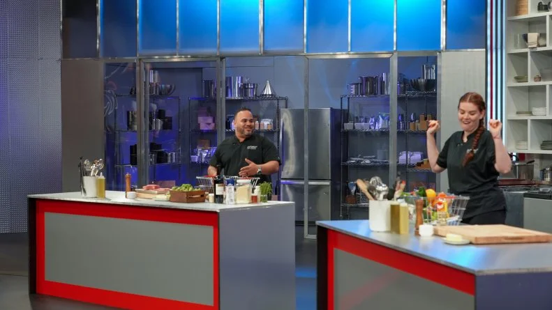 Contestants Kelvin Fernandez, and Julia Chebotar at their stations, as seen on the Cutthroat Kitchen, season 1.