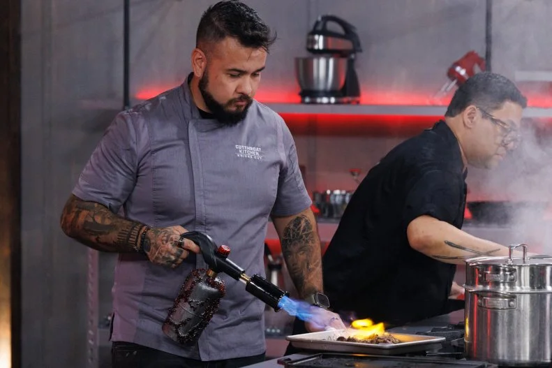 Chef Quentin Garcia cooks with a blowtorch as his only heat source after being sabotaged during round two, as seen on Cutthroat Kitchen: Knives Out, Season 1.