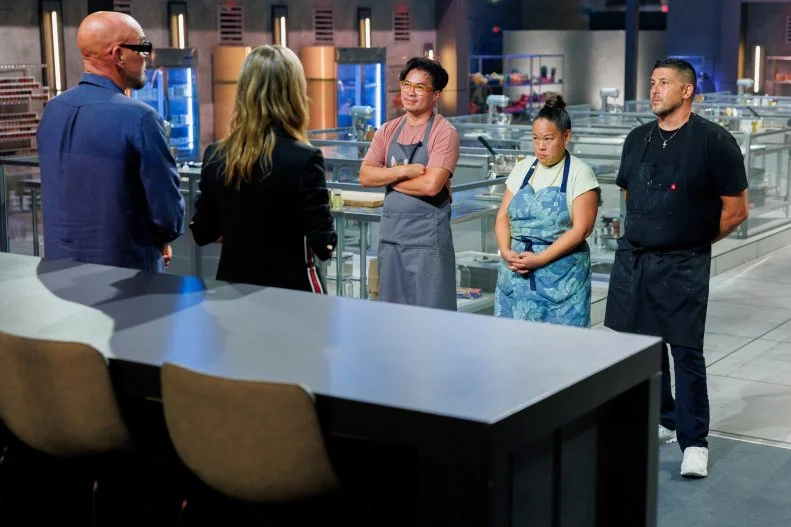 Hosts Michael Symon and Esther Choi deliver results to Contestants Viet Pham, Joe Isidori and Lee Anne Wong, as seen on 24 in 24: Last Chef Standing, Season 3.