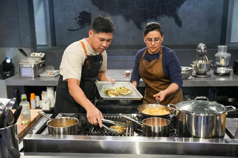 Chef Kevin Tien and Paola Serrano cooking (L to R), as seen on Alex Vs. America, Season 5.