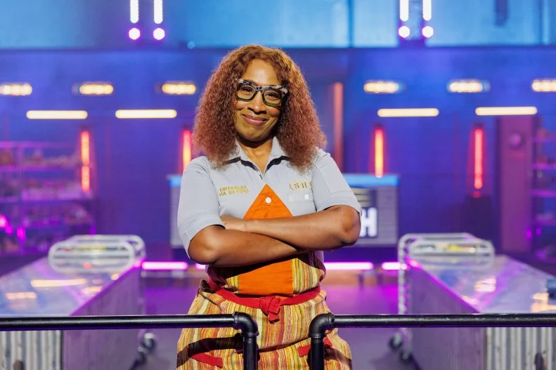Contestant Tia Raiford hero pose, as seen on Chef Grudge Match, Season 1.