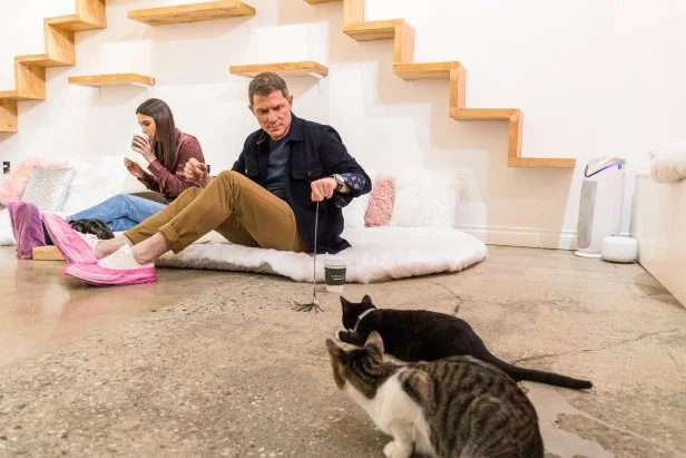 Host Bobby and Sophie Flay play with cats at Crumbs and Whiskers in Hollywood, CA, as seen on Bobby and Sophie Take the Coast, Season 1.