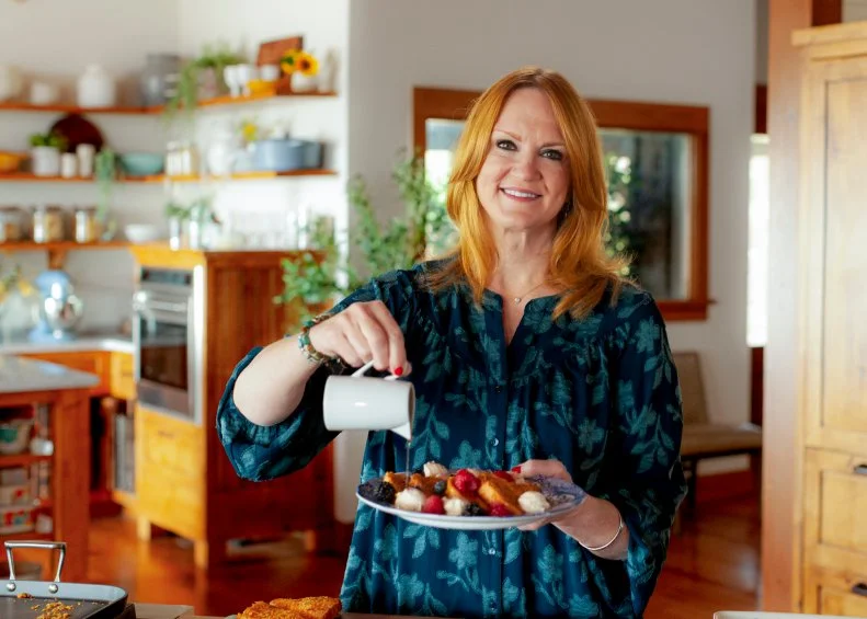 Ree Drummond pouring syrup on Crunchy French Toast, as seen on The Pioneer Woman, Season 35.