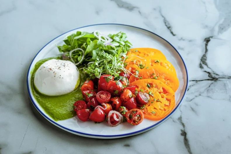 Close-up of Heirloom Tomato Salad, as seen on The Pioneer Woman, Season 35.
