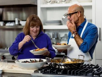 Ina Garten cooking fish stew with Stanley Tucci, as seen on Be My Guest with Ina Garten, season 3.