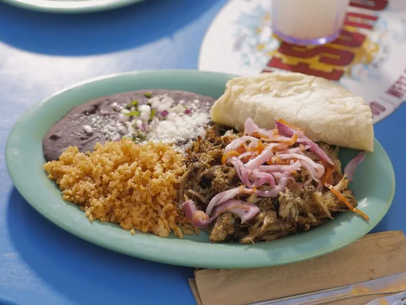 Carnitas Guerrero as prepared by Chef Mayra Vazquez at El Tesoro in Atlanta, Georgia, as seen on Food Network's Diners Drive-Ins and Dives, season 41.