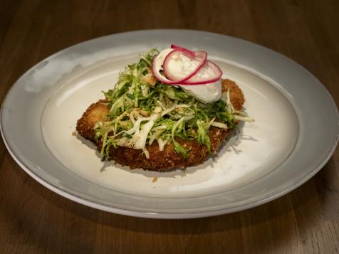 Pork Milanese with Pickled Onions, Frisée, Hazelnuts and Poached Egg
