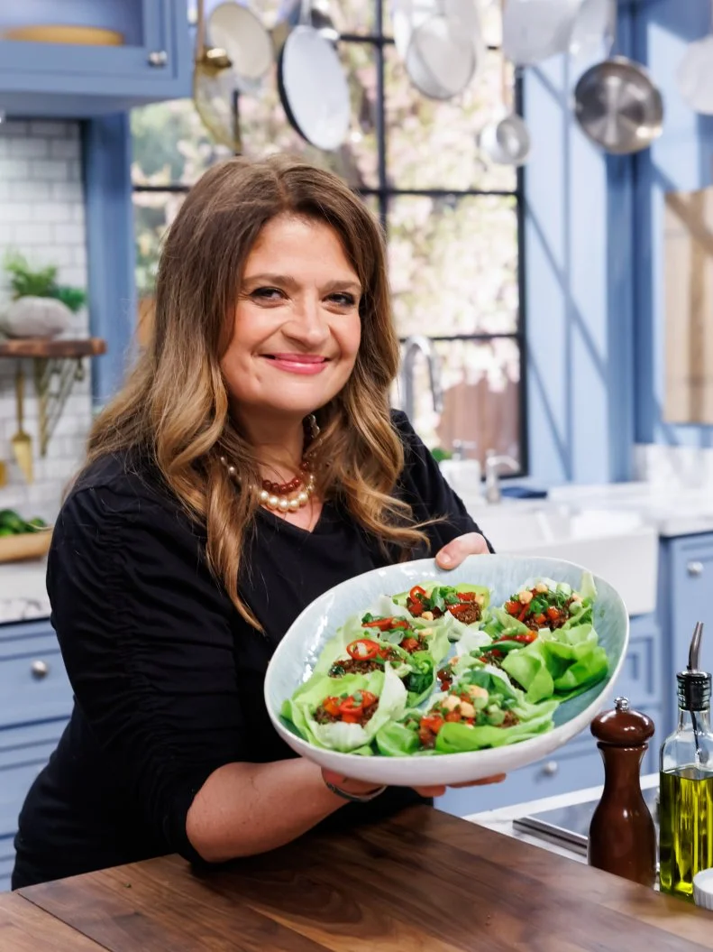 Alex Guarnaschelli poses with her Quinoa and Herb Lettuce Cups, as seen on The Kitchen, Season 33.