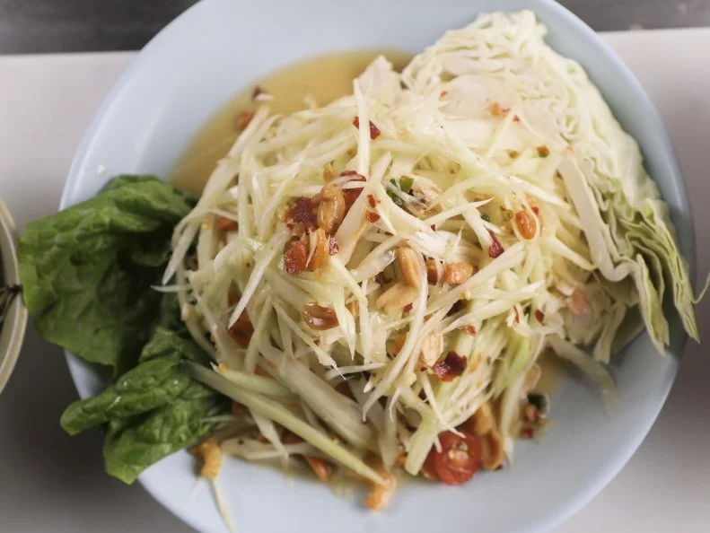 Papaya Salad as prepared by Chef Champ Jansaeng at Ruen Pair in Los Angeles, California, as seen on Food Network's Diners Drive-Ins and Dives, season 42.