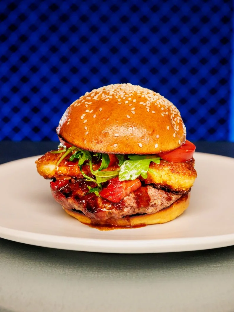 Contestant CL beauty of dish - Classic burger, Pancetta Jam, Breaded and pan fried Halloumi Cheese, as seen on Chef Grudge Match, Season 1.