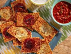 Leave it up to the internet to make a classic recipe actually new and cool. This time around it's the simple frico chip, which is simply a crisp round of melted and caramelized cheese. I like them broken up over a salad or even in a burger as a crunchy cheese element. You can make them on the stovetop or bake them, and that's where this classic remake, started by social media, begins. Just adding one ingredient to the ride in the oven made it new again: the onion. One influencer featured it, and the next thing you know, everyone was putting their twist on this easy frico update, including me. I decided to add a few more things, and it turned into, sometimes, the best part of the pizza for me, the top!